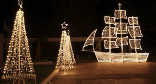 Christmas ship and trees at night