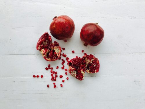 Smashing pomegranate on New Year